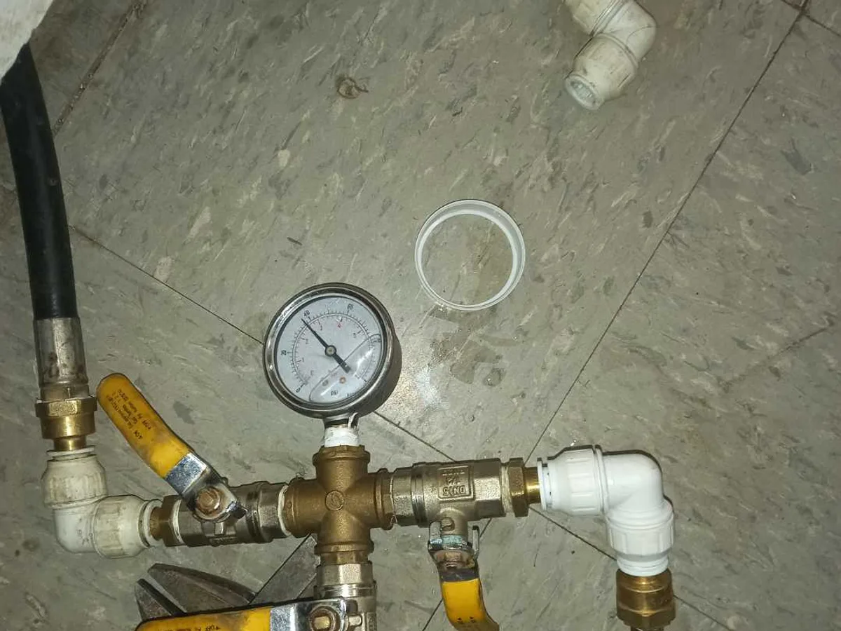 pressure test rig with gauge showing successful result after works completed on mains repair