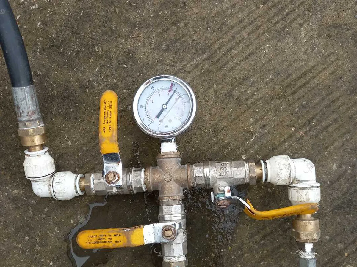pressure test rig with gauge connected to mains pipework during leak detection