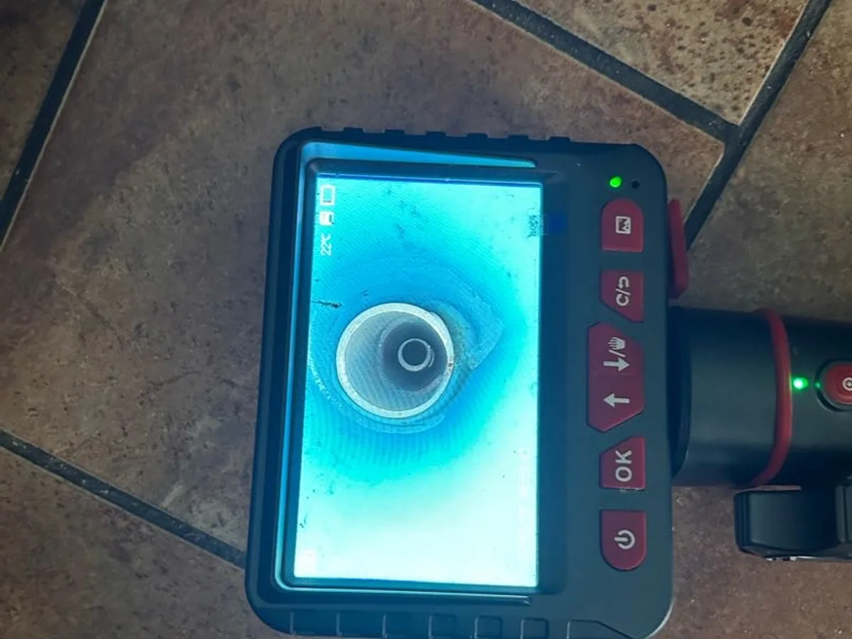 endoscope camera screen showing interior of supply pipe during leak detection investigation