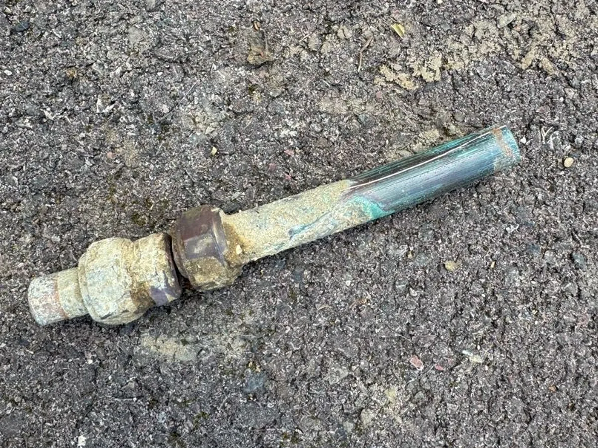 fault identified at heavily corroded underground pipe coupling removed from external mains — leak located at