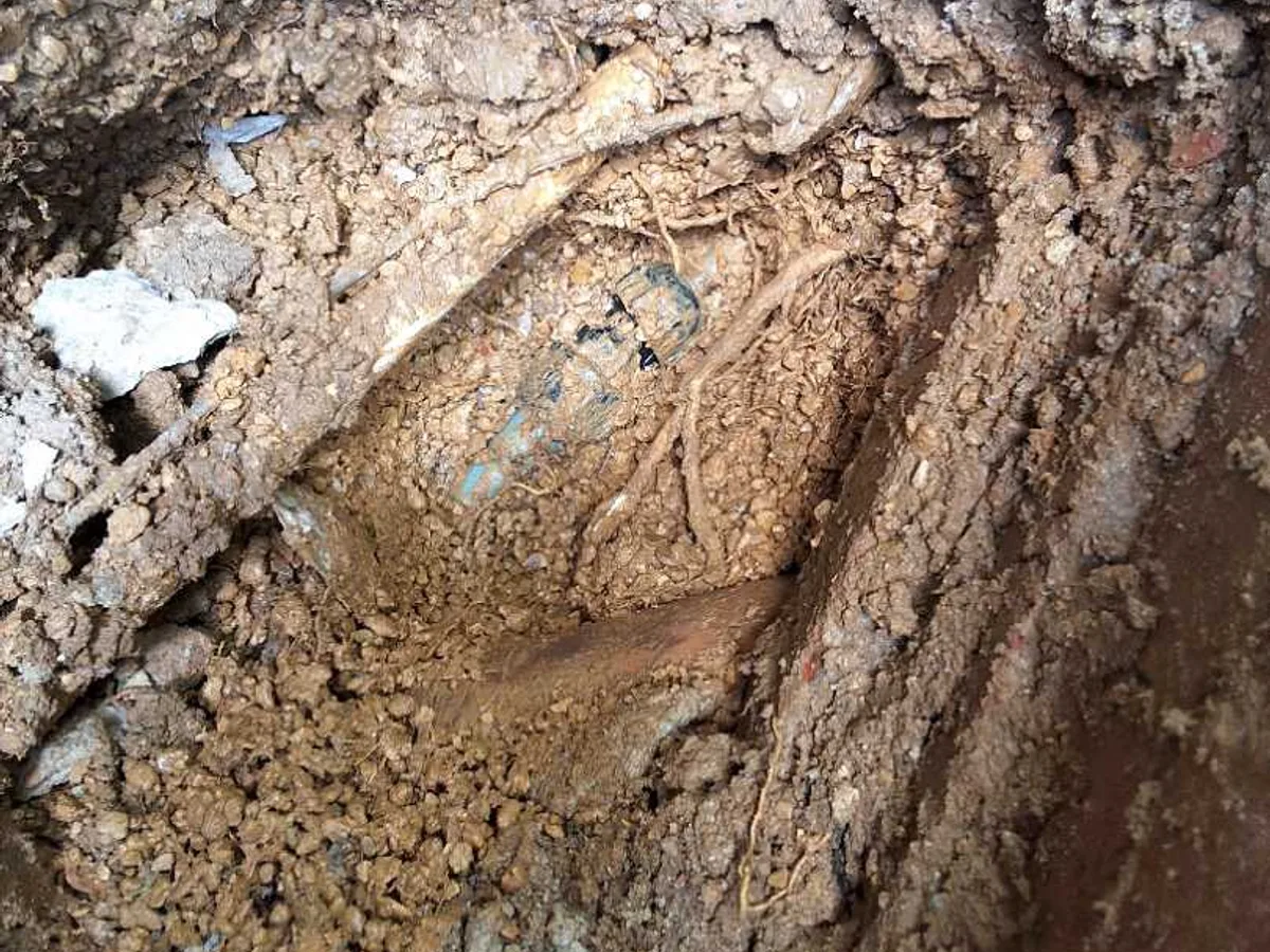 fault identified at poorly installed copper to MDPE conversion joint buried in courtyard soil — leak located at