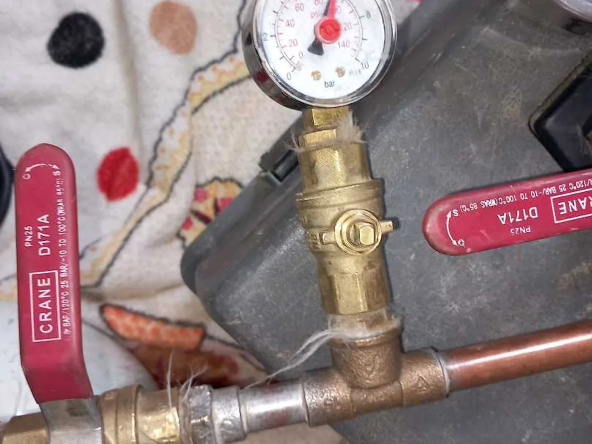 air pressure test rig with gauge connected to copper pipework during leak detection