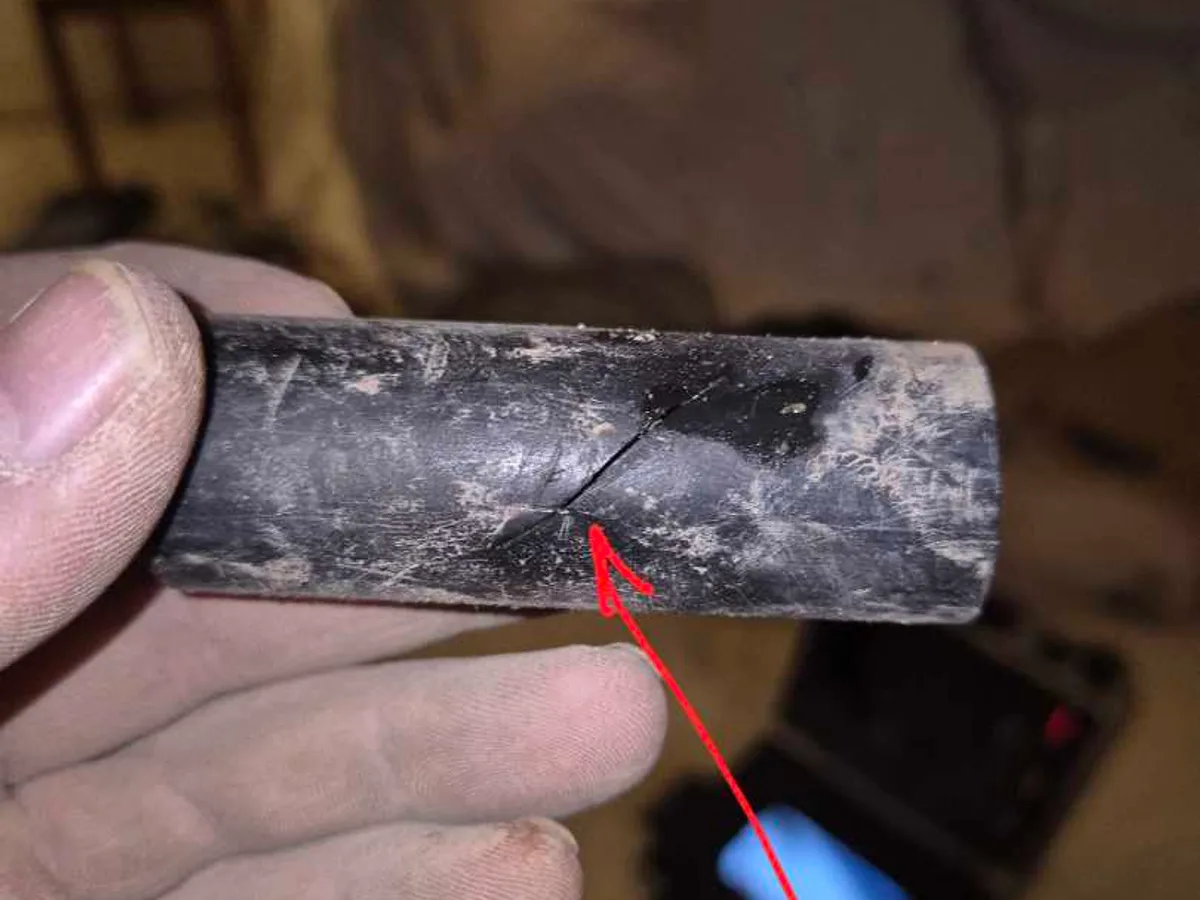 leak located at split in 25mm MDPE water mains pipe removed from below lounge floor