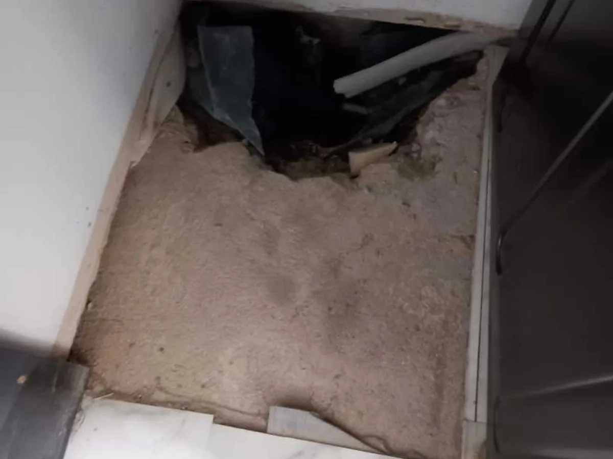 leak located beneath utility room floor with concrete broken out exposing pipework below — leak located at