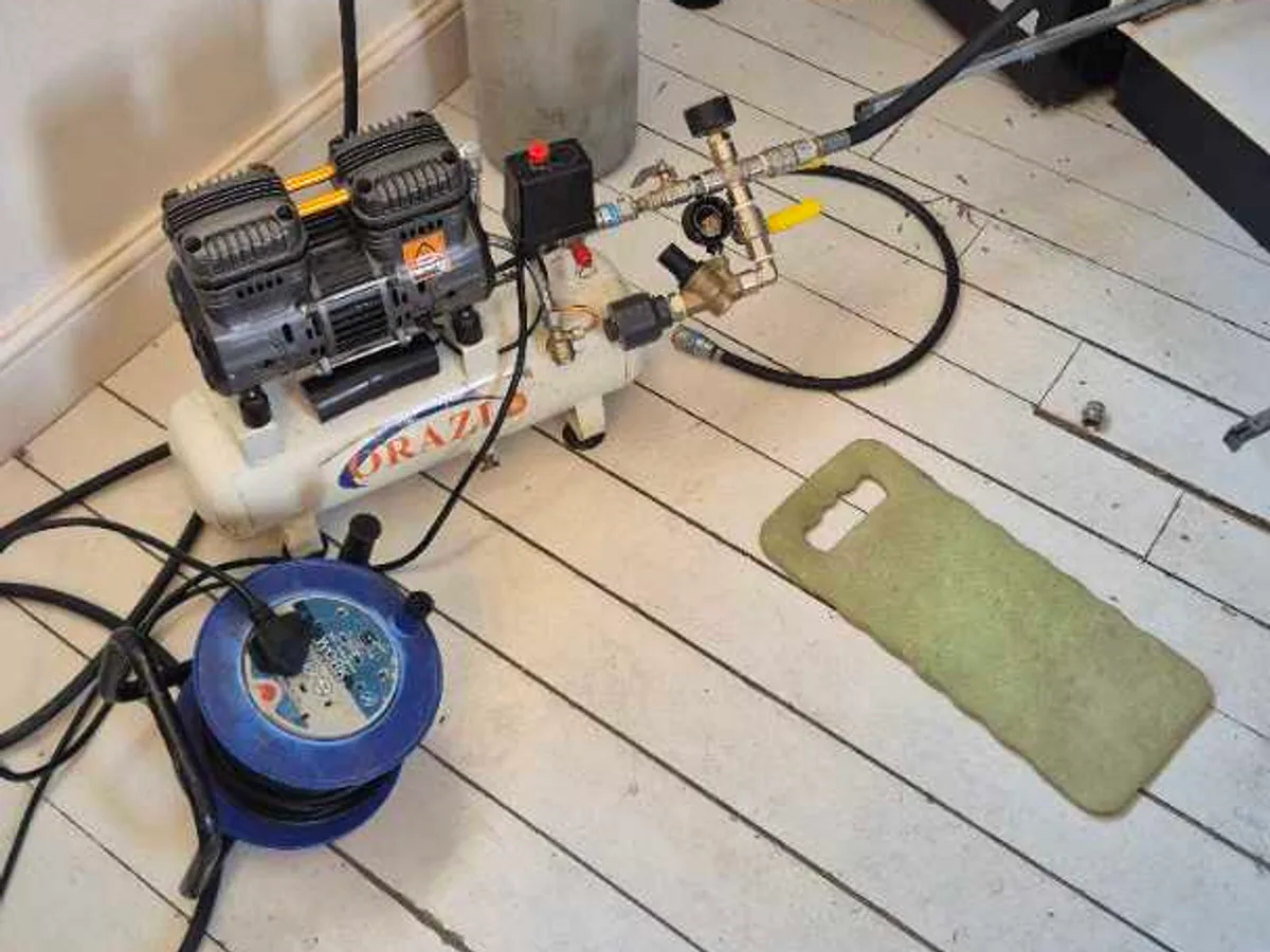 air compressor connected to mains supply pipework during leak detection pressure test