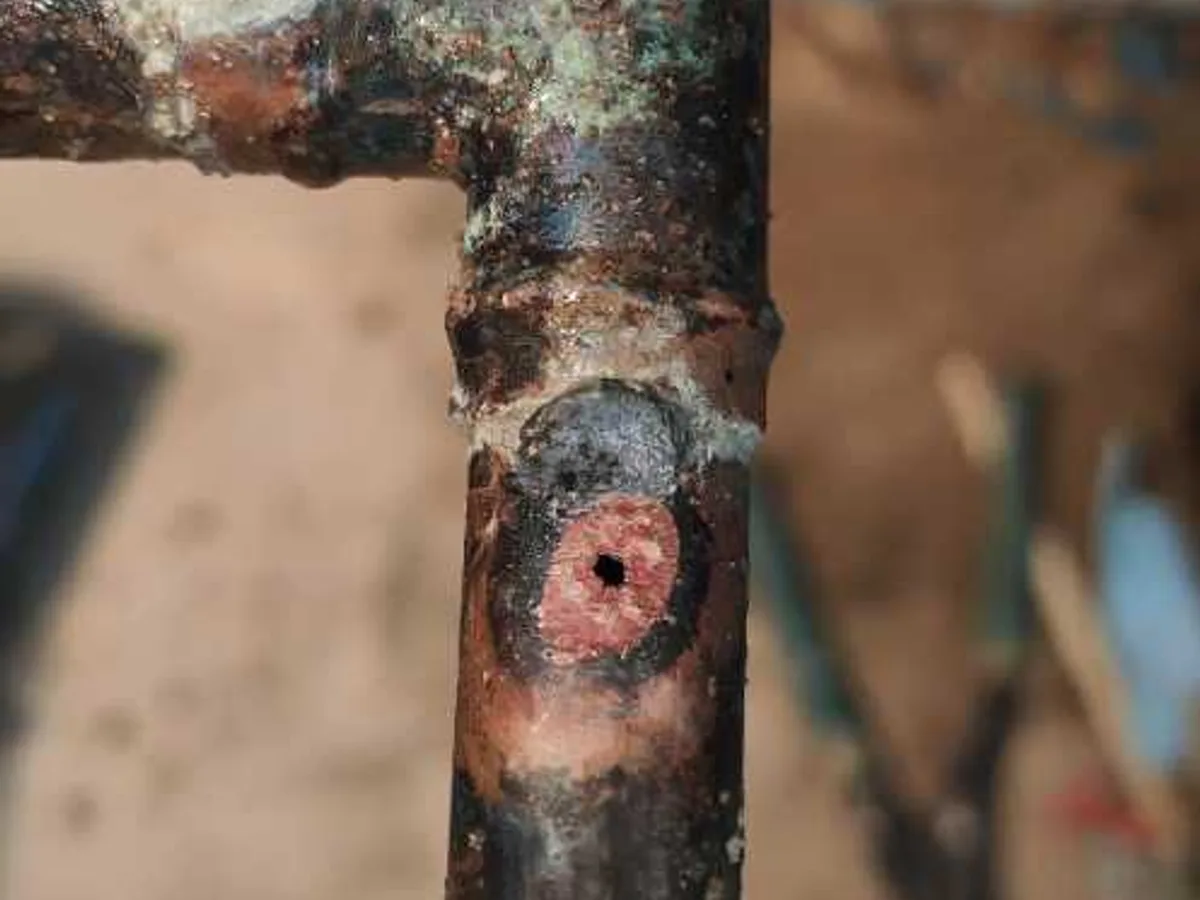 fault exposed at pinhole corrosion on removed 15mm copper pipe section