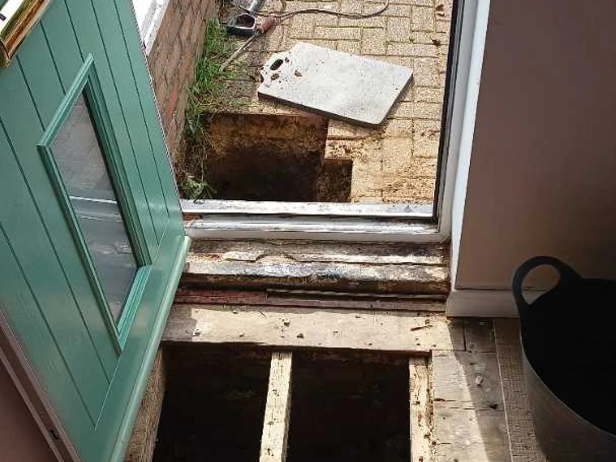 suspended floor boards lifted and driveway excavated during leak detection investigation