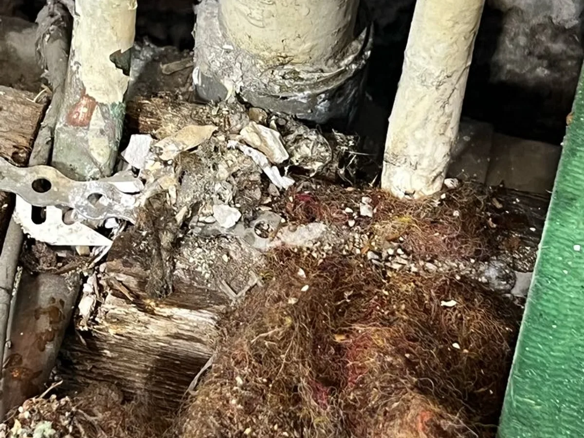 leak found at base of corroded plastic pipework with saturated and deteriorated subfloor material