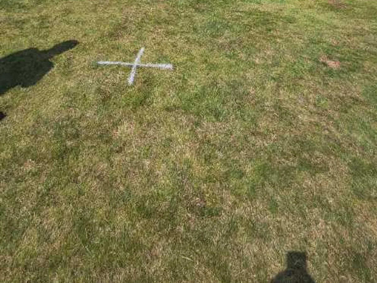 leak located beneath lawn marked with painted cross adjacent to garden house — leak located at