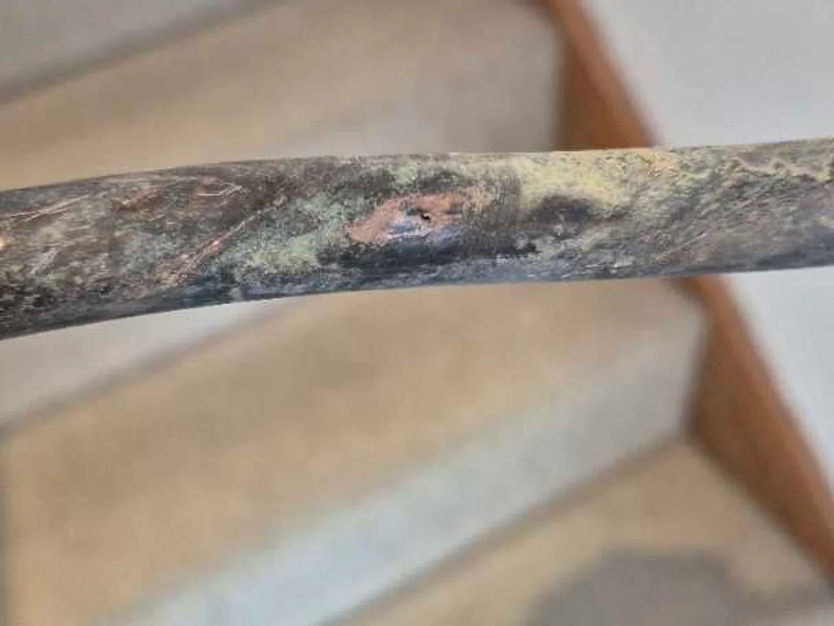 fault identified at heavily corroded 15mm copper mains supply pipe removed from beneath floor — leak located at