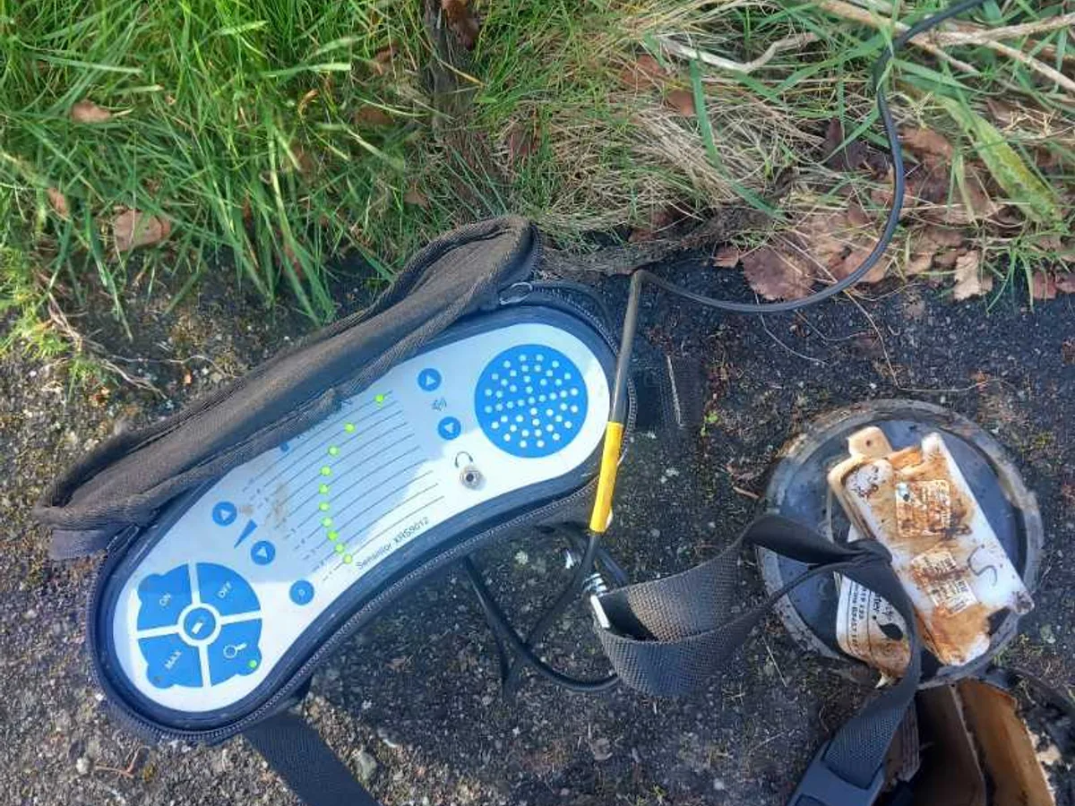 acoustic listening device placed on front garden grass during leak detection survey