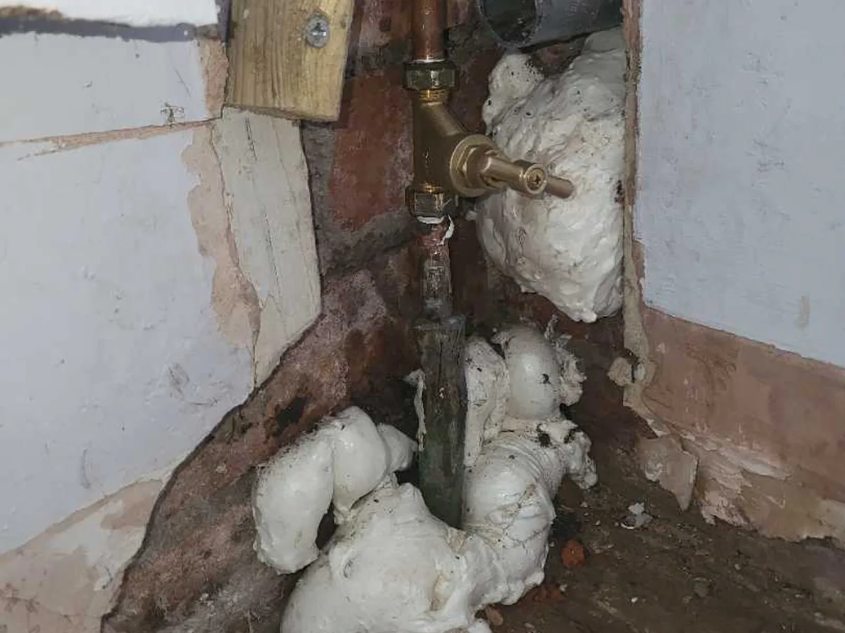 leak found at old internal stopcock and corroded pipework exposed within wall cavity