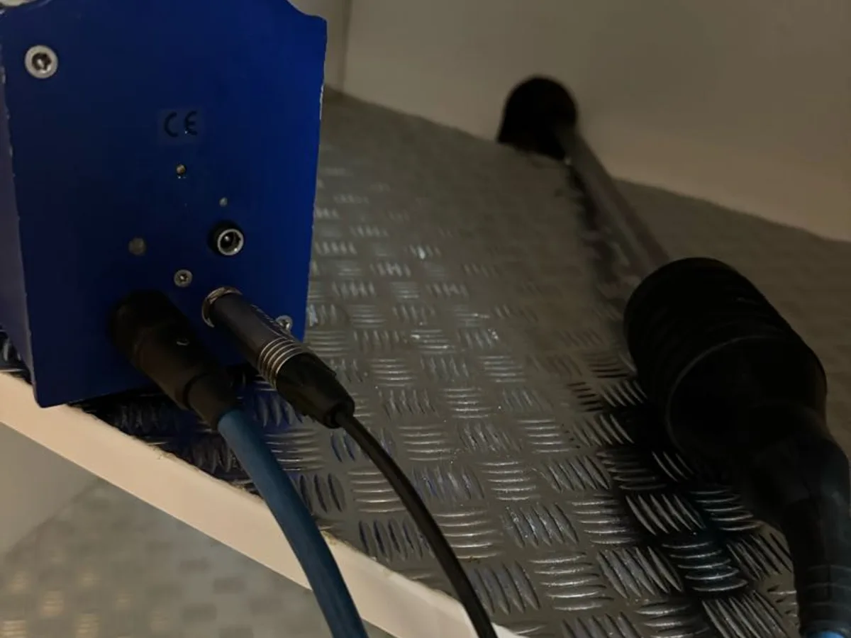 acoustic amplifier unit with ground microphone connected on kitchen floor during leak detection
