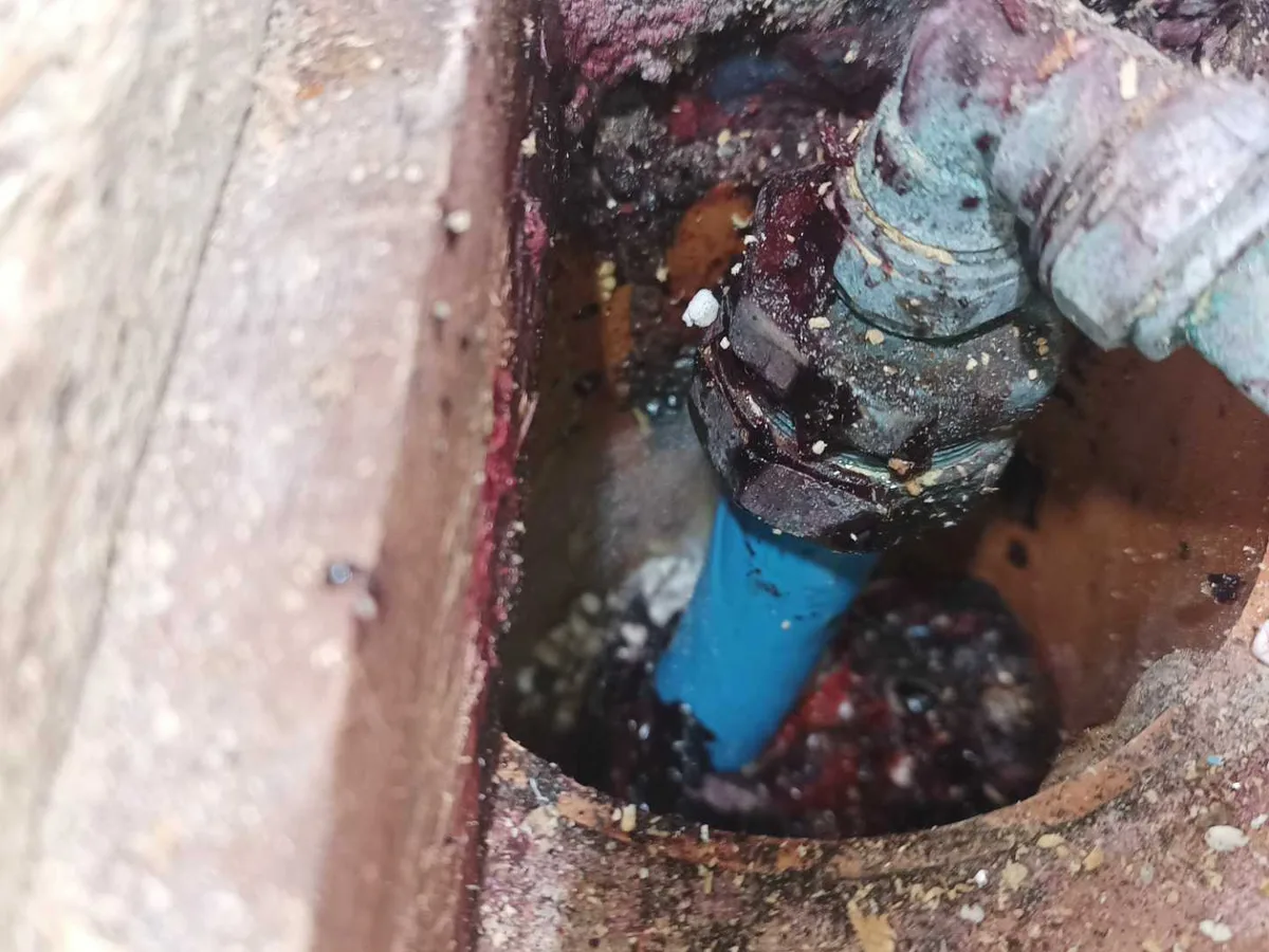 leak located at corroded 25mm MDPE fitting beneath kitchen floor close-up