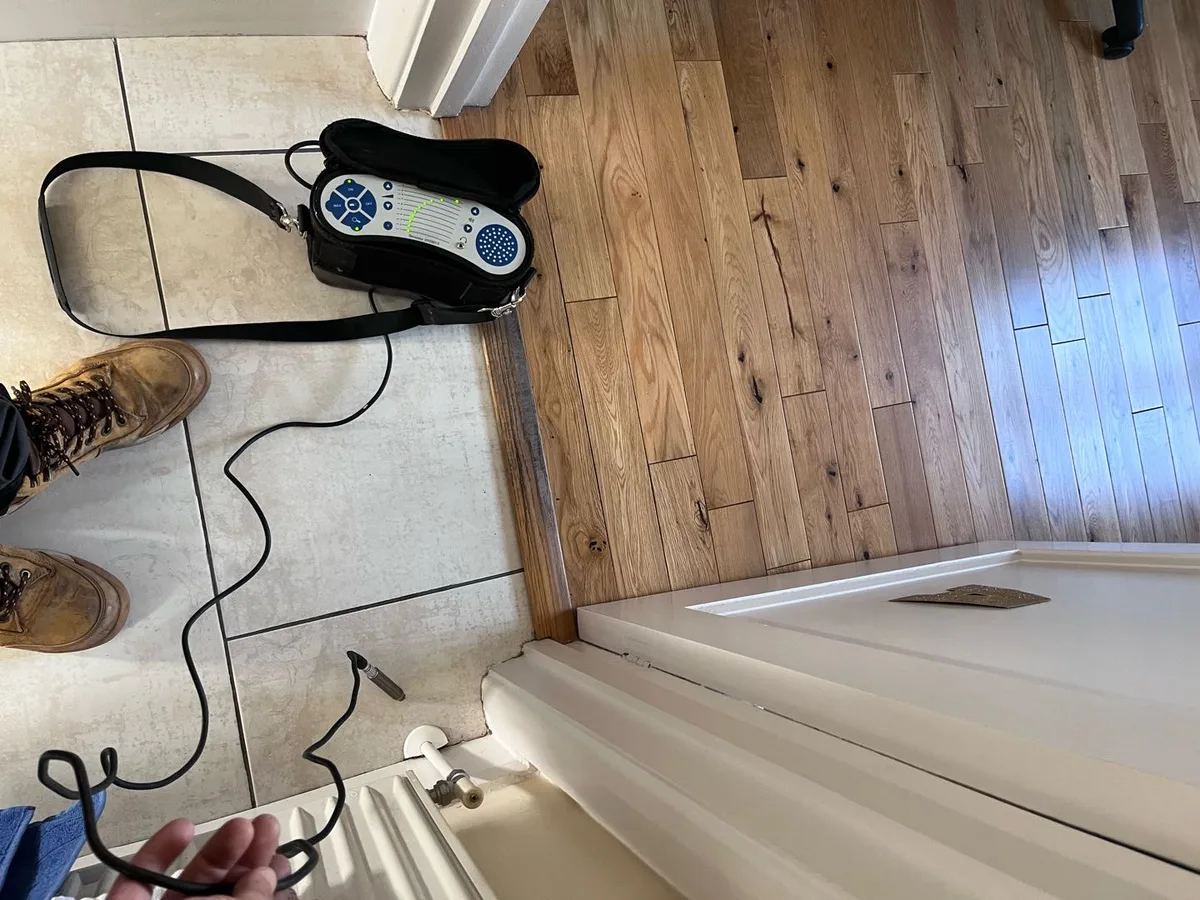 acoustic listening device placed on tiled floor during leak detection survey