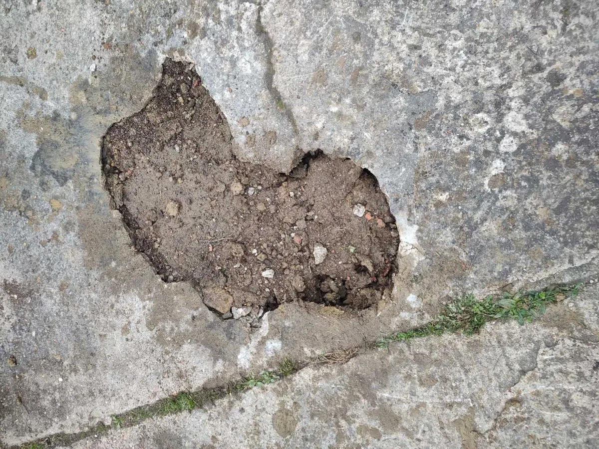 concrete driveway excavation backfilled and reinstated after repair