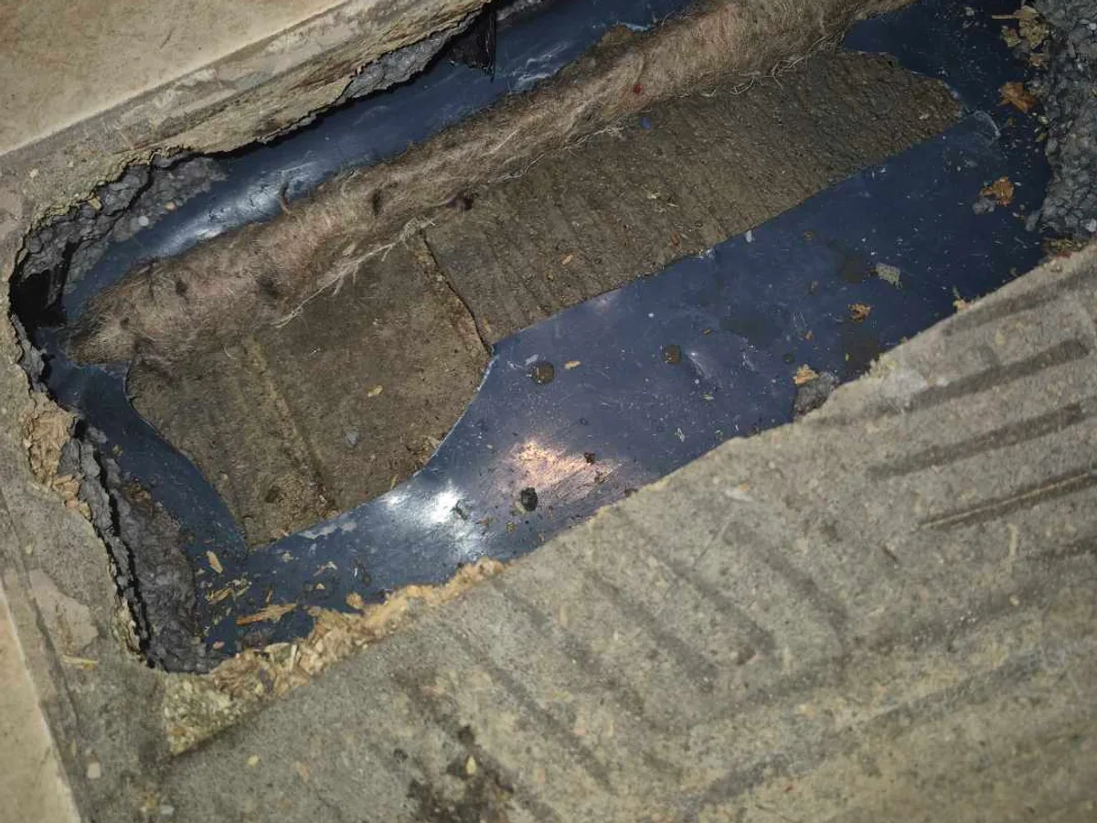 fault identified at failed copper mains supply with water visible on concrete floor under kitchen — leak located at