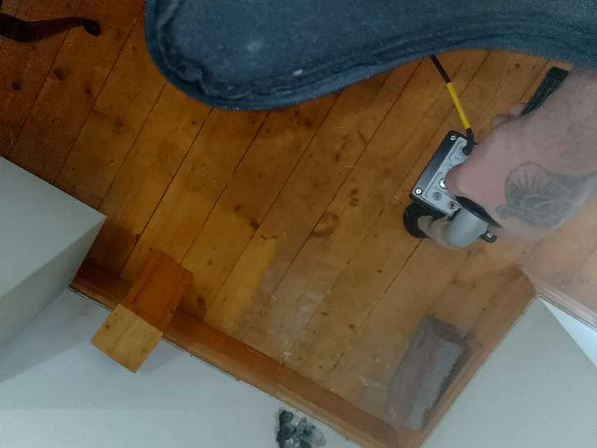 acoustic listening probe applied to timber floorboards during leak detection