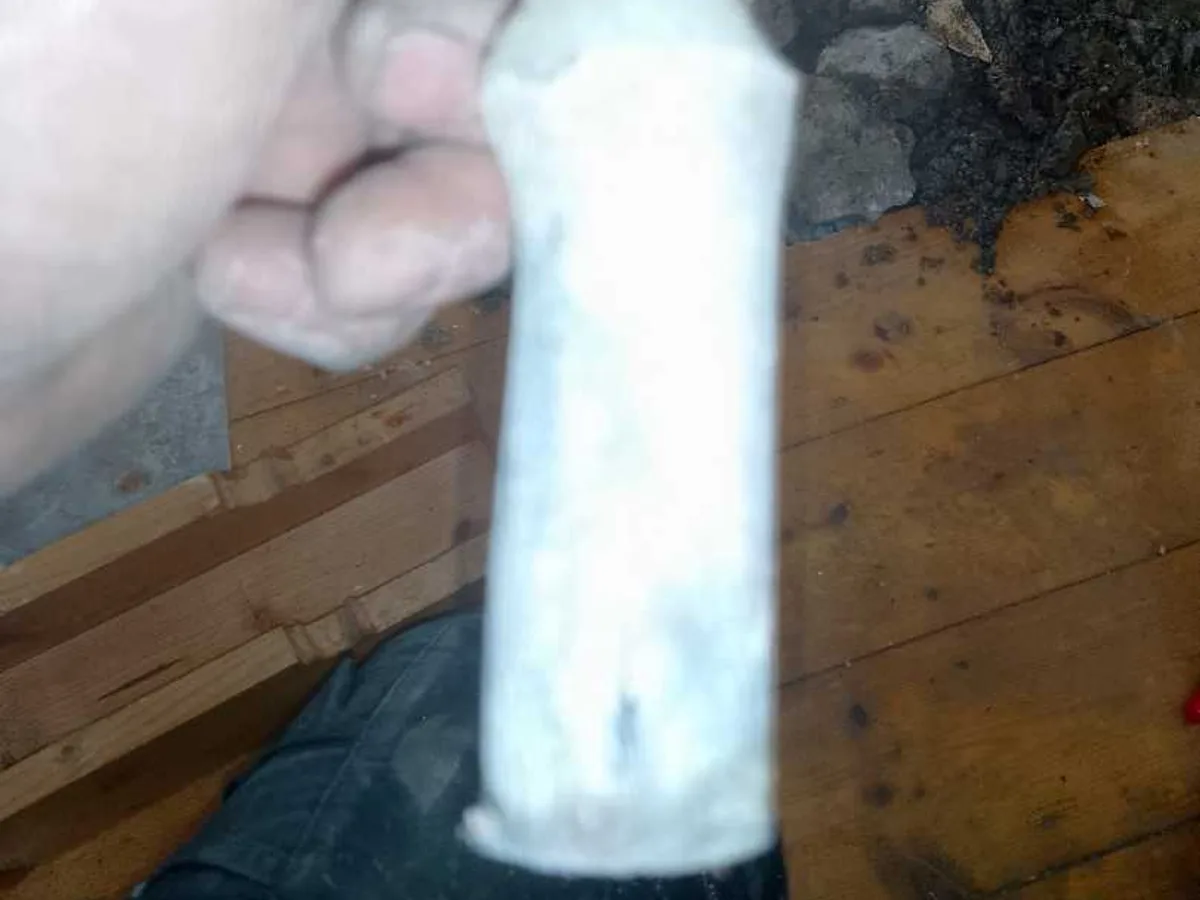 fault identified at old lead mains pipe exposed beneath lifted floorboards — leak located at