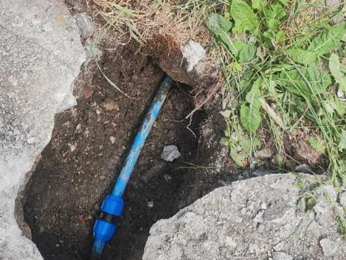 new 25mm MDPE coupler installed in excavation as repair completed