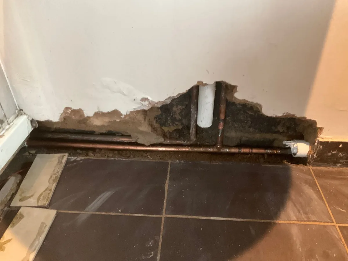 leak found at copper cold mains pipe exposed after waste pipes removed from ensuite wall