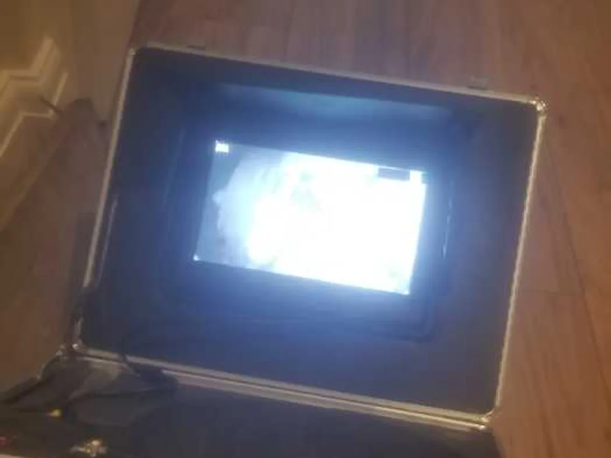 endoscope camera monitor unit in use on kitchen floor during leak detection survey