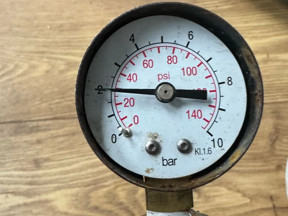 pressure gauge showing reading on mains pipe during leak detection survey