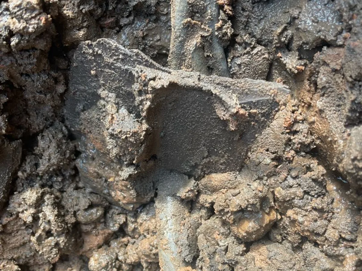 fault exposed at corroded underground pipe fitting following excavation in back garden
