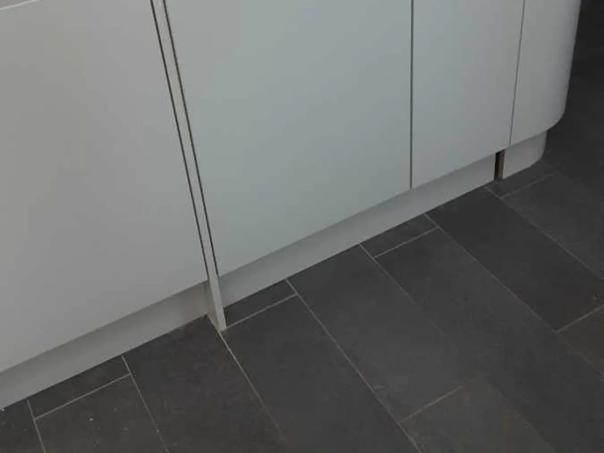 kitchen base unit above suspected leak area during leak detection survey