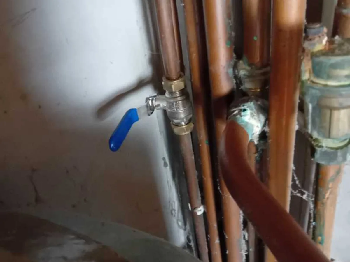 isolation valve fitted to cold mains copper pipework in airing cupboard during leak detection
